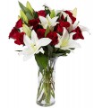 1 Florero de Vidrio, 10 Rosas, 6 Varas de Liliums/ 2 Flores por Tallo